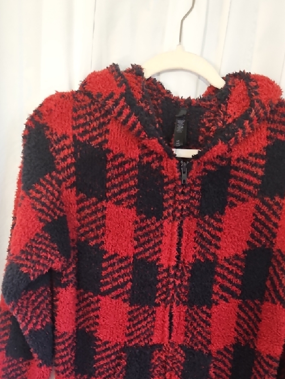 SKIMS Cozy Knit Unisex Onesie in the red and black "Brick Buffalo Check" pattern - Picture 2 of 6